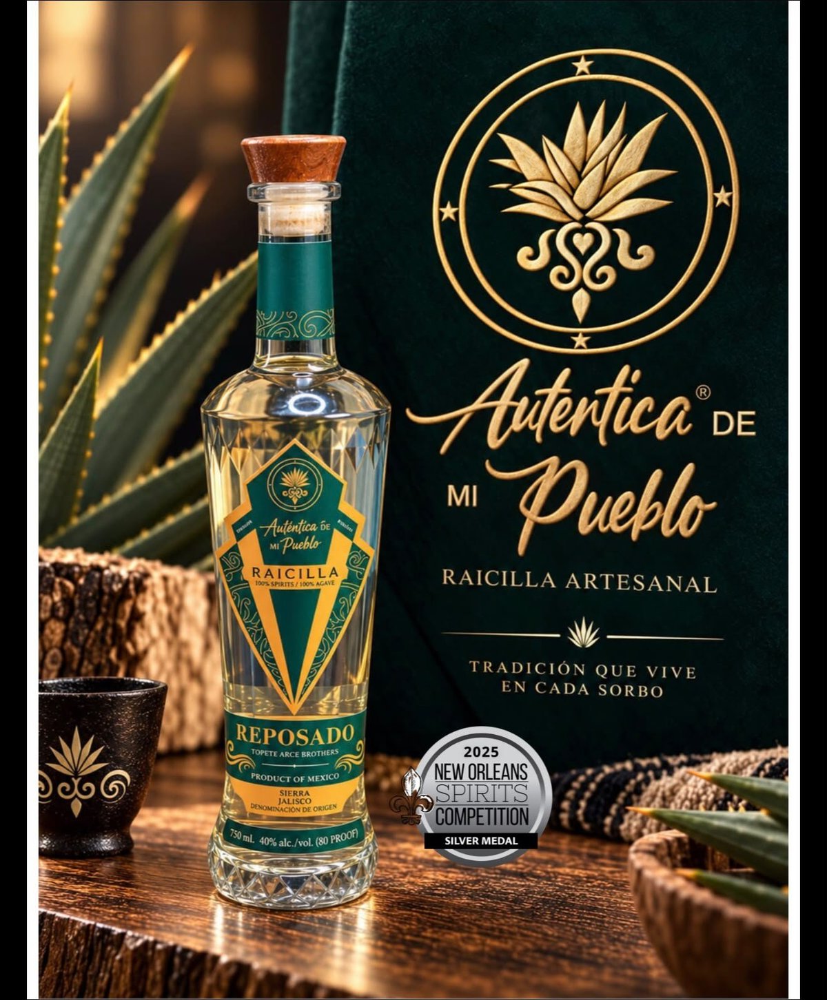 Bottle of Autentica de Mi Pueblo reposado tequila displayed with agave plants and award medal on wooden surface